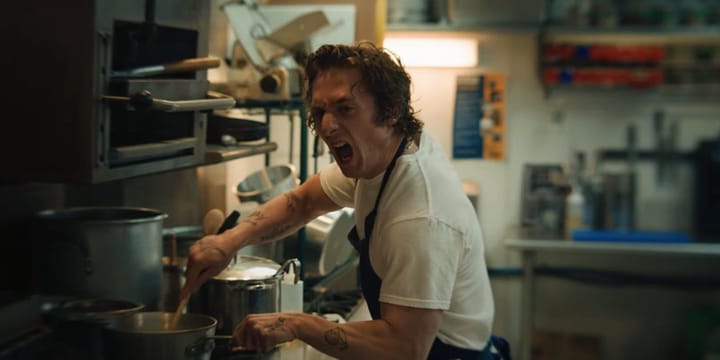 The Bear's Carmen screaming while cooking at the stove in the restaurant's kitchen.